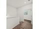 Upstairs hallway with carpeted floors and views of the house at 148 Inman Dr, Canton, GA 30114