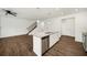 Kitchen with stainless steel appliances, center island, and open layout to living area at 148 Inman Dr, Canton, GA 30114