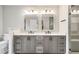 Bathroom featuring double vanity with granite countertop and glass-enclosed shower at 185 Nickajack Se Rd, Mableton, GA 30126