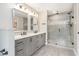 Bathroom with double vanity, granite countertop, and glass-enclosed shower at 185 Nickajack Se Rd, Mableton, GA 30126