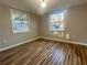 Serene bedroom with wood-look flooring, base molding, and natural light at 185 Nickajack Se Rd, Mableton, GA 30126