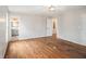 Spacious bedroom with hardwood flooring and neutral paint with an ensuite bathroom and walk-in closet at 185 Nickajack Se Rd, Mableton, GA 30126