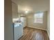 Bright kitchen with a refrigerator, updated appliances, and wood-look floors at 185 Nickajack Se Rd, Mableton, GA 30126