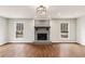 Bright living room featuring hardwood floors and fireplace at 185 Nickajack Se Rd, Mableton, GA 30126