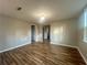 Open living room with wood-look floors and neutral paint tones at 185 Nickajack Se Rd, Mableton, GA 30126