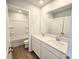 Bathroom featuring double sink vanity, a large mirror and shower-tub combo with brushed nickel hardware at 2371 Brown Dove Way Lot 4, Grayson, GA 30017