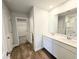 Bathroom features modern vanity with double sinks, a separate toilet room and walk-in closet at 2371 Brown Dove Way Lot 4, Grayson, GA 30017