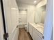 Bathroom offers modern double sink vanity, framed mirror and shower-tub combo at 2371 Brown Dove Way Lot 4, Grayson, GA 30017