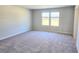 Bedroom features carpeting and two windows that allow for natural lighting at 2371 Brown Dove Way Lot 4, Grayson, GA 30017