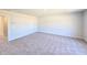 Large bedroom featuring neutral walls and plush gray carpet at 2371 Brown Dove Way Lot 4, Grayson, GA 30017