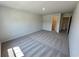 Spacious bedroom with neutral carpet and a walk in closet at 2371 Brown Dove Way Lot 4, Grayson, GA 30017