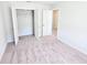 Bedroom with light gray walls, carpet, and a closet with shelving for storage at 2371 Brown Dove Way Lot 4, Grayson, GA 30017
