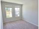 Cozy bedroom features carpeted floors, neutral walls, and natural light from windows at 2371 Brown Dove Way Lot 4, Grayson, GA 30017