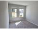 Cozy bedroom with carpeted flooring, offering a view of the neighborhood at 2371 Brown Dove Way Lot 4, Grayson, GA 30017