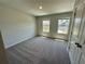 Bright bedroom featuring carpet, neutral paint and two windows offering natural light at 2371 Brown Dove Way Lot 4, Grayson, GA 30017