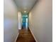 Hallway showcasing wood floors, leading into an open-concept living area at 2371 Brown Dove Way Lot 4, Grayson, GA 30017