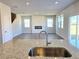 Spacious living room with wood floors, fireplace, and view from the kitchen island at 2371 Brown Dove Way Lot 4, Grayson, GA 30017