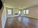 Spacious living room featuring wood floors, a modern fireplace, and bright windows at 2371 Brown Dove Way Lot 4, Grayson, GA 30017