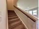 Carpeted staircase with wooden handrail at 2371 Brown Dove Way Lot 4, Grayson, GA 30017
