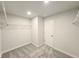 Bright walk-in closet featuring a door, neutral walls, and wire shelving at 2371 Brown Dove Way Lot 4, Grayson, GA 30017