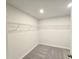 Spacious walk-in closet with gray carpet and white wire shelving for ample storage at 2371 Brown Dove Way Lot 4, Grayson, GA 30017