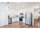 Modern kitchen features stainless steel appliances, granite countertops, and ample cabinet space at 579 Magnolia Cir, Palmetto, GA 30268