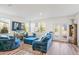 Spacious living area with natural light, luxury vinyl flooring, and comfortable furnishings at 579 Magnolia Cir, Palmetto, GA 30268
