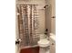Full bath showing tub and shower with patterned curtain, with contemporary sink and fixtures at 806 Marcus Se St # 21, Atlanta, GA 30316
