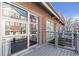 Townhome exterior showcasing a brick facade, deck with gray railings, and access to outdoor space at 806 Marcus Se St # 21, Atlanta, GA 30316