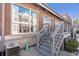 Brick building exterior shows large window, exterior stairs, concrete foundation, and air conditioning unit at 806 Marcus Se St # 21, Atlanta, GA 30316