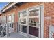 Townhome exterior featuring brick, deck, sliding glass doors, and large windows for natural light at 806 Marcus Se St # 21, Atlanta, GA 30316