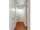 Hallway featuring multiple closet doors and overhead lighting, providing ample storage at 806 Marcus Se St # 21, Atlanta, GA 30316
