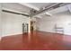 Open concept living space featuring polished floors and bright windows, with bar table and shelving unit at 806 Marcus Se St # 21, Atlanta, GA 30316