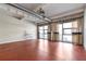 Bright, open living space featuring polished floors, exposed ductwork, and large bright windows at 806 Marcus Se St # 21, Atlanta, GA 30316