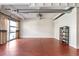 Open living area with polished concrete floors, exposed ductwork, and large bright windows at 806 Marcus Se St # 21, Atlanta, GA 30316