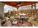 Backyard patio featuring an inviting outdoor seating area under a covered pergola at 11 Montclair Ct, Cartersville, GA 30121