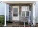 Inviting front porch with stone facade, offering a cozy and stylish entrance to the home at 11 Montclair Ct, Cartersville, GA 30121