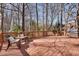 Back deck with outdoor furniture, including a stainless steel grill, great for outdoor gatherings and relaxation at 1865 Berkeley Mews Ne, Atlanta, GA 30329