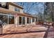 Spacious outdoor back deck with ample seating, perfect for entertaining guests or enjoying a relaxing evening at 1865 Berkeley Mews Ne, Atlanta, GA 30329