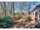 Charming backyard featuring a wooden fence and steps leading to a lovely back deck, ideal for outdoor enjoyment at 1865 Berkeley Mews Ne, Atlanta, GA 30329