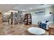 Finished basement features tile floors, recessed lighting, bookshelves, and a sitting area at 1865 Berkeley Mews Ne, Atlanta, GA 30329