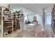 Finished basement includes tile floors, recessed lighting, bookshelves, and white columns at 1865 Berkeley Mews Ne, Atlanta, GA 30329