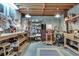 Unfinished basement features wood countertops, open ceiling, and tool storage at 1865 Berkeley Mews Ne, Atlanta, GA 30329