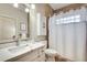 Bathroom featuring a vanity with ample storage and a shower with a curtain at 1865 Berkeley Mews Ne, Atlanta, GA 30329