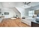 Spacious bedroom features hardwood floors, ample natural light, and a cozy sitting area at 1865 Berkeley Mews Ne, Atlanta, GA 30329