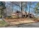 Charming single-story home featuring a side-entry garage and well-maintained landscaping at 1865 Berkeley Mews Ne, Atlanta, GA 30329