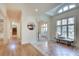 Sunlit foyer featuring tile flooring, natural light, and views into the dining room and stairs at 1865 Berkeley Mews Ne, Atlanta, GA 30329