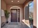 Inviting front entryway with a decorative wooden door and tiled flooring at 1865 Berkeley Mews Ne, Atlanta, GA 30329