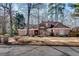 Charming single-Gathering home featuring manicured landscaping and a well-maintained facade with a welcoming entrance at 1865 Berkeley Mews Ne, Atlanta, GA 30329