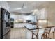 Bright, modern kitchen with a breakfast bar and stainless steel appliances at 1865 Berkeley Mews Ne, Atlanta, GA 30329